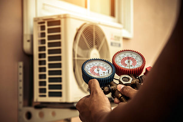 Professional Air Conditioning Service technician working in Perrysburg, NY